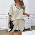 Women's two-piece knit set featuring V-neck short sleeve top and shorts in cream with black trim - S / White