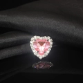 Macro shot of pink heart crystal ring with diamond halo on black satin background - Light Pink