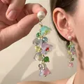 Detail of colorful floral tassel earrings with pearl studs and long petal fringe - 21# Silver Earring Post - Multicolor