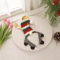 Christmas gnome cutlery holder with red and green striped hat on a white dining plate - Grey Gnome Cutlery Holder / Gray