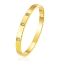 Macro view of gold PVD plated stainless steel bangle with four round crystal inlays - Round Zirconia Style (MS-822-5) / Gold