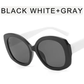 Fashionable oversized oval sunglasses featuring a chic black frame with white temples - Glossy Black Frame Full Grey Lens - White Leg