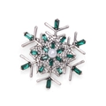 Silver snowflake brooch with green rhinestones and a white pearl center on white background - Pearl Snowflake