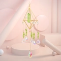 Detailed macro view of crystal suncatcher with green raw stone and gold geometric frame - Green Crystal