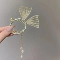 Golden fishtail hair claw clip with rhinestones and pearl tassels held in hand - F0376 Gold Mermaid