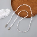 Iridescent crystal heart beaded crossbody chain with metal clasps on a grey background - 60CM / White