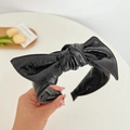Close-up of the glossy black PU leather bow headband with premium textured finish - Leather Bow Headband / Black