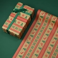 Christmas kraft paper roll with red reindeer and green trees and wrapped gift box - Striped Christmas