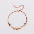 Pulsera de acero inoxidable oro rosa con tres dijes de corazón y cierre de mosquetón ajustable - Oro rosa