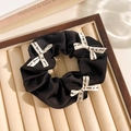 Black floral lace scrunchie with white printed ribbons on a velvet display tray - Black Band White Bow