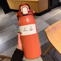 Detail of coral orange 304 stainless steel vacuum insulated tumbler with portable handle - 1700ML / Red