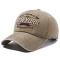 Vintage khaki washed cotton baseball cap with New York 3D embroidery on white backdrop - Khaki