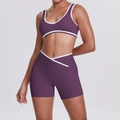 Detail of high-waisted yoga set with cross waist design and white contrast piping - Giga Purple