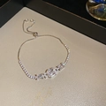 Detailed close-up of adjustable tennis bracelet with three square-cut zircon stones - Silver