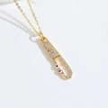 Golden safety pin necklace featuring white zircons and colorful evil eye charms - Pink Purple Small Eyes