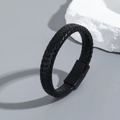 Close-up of men's braided leather bracelet with matte black magnetic metal clasp - Black