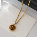 Close-up of golden rope chain necklace with a round tiger eye stone pendant - Twisted Rope Round Pendant (26#)