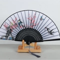 Japanese style bamboo folding fan featuring floral bird patterns and black hollow ribs - Black Ribs Pattern 39