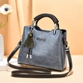 Blue-grey wax leather tote bag with PU texture, green charm and detachable strap - Blue
