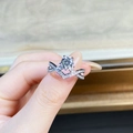 925 sterling silver criss-cross ring with 1ct moissanite stone held by hand - US 5 / Crossed Double Band 1ct-Silver