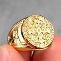 Macro shot of gold-plated St. Benedict medal ring with detailed cross relief and religious symbols - US 7 / Gold