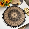 Jute Christmas placemat with snowflake pattern and black pom-pom trim on white table - Style 5 Black (Pom-poms)