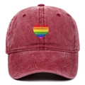 Detail of burgundy washed denim baseball cap featuring colorful rainbow heart embroidery - One Size / Burgundy