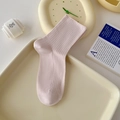 Minimalist soft pink crew socks with vertical ribbed texture on a cream display tray - One Size / Milky Pink