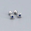 Silver star stud earrings with a blue gemstone center and secure screw back closure - Platinum (Blue Zirconia)