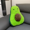 Cute avocado plush toy pillow with smiling face on grey leather sofa backdrop - Avocado Pillow / 43*30*25cm