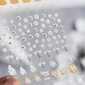 5D embossed white daisy nail stickers with delicate floral textures on clear backing - KX088-5D Embossed(K8360)