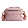 Pale pink waterproof nylon crossbody bag with multi-zipper pockets and gold hardware - Pink