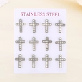 Macro shot of twelve silver stainless steel cross earrings with sparkling crystals - Silver