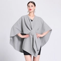 Women's stylish grey knitted cape shawl with an asymmetric drape and front twist knot - One Size / Light Gray