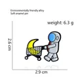 Cartoon astronaut with moon cart enamel pin in grey finish, alloy lapel brooch - Astronaut with Moon Cart