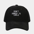 Detail of white embroidered slogan on black corduroy baseball cap texture - Adjustable / Black