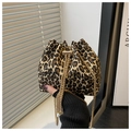 Detail of leopard print bucket bag with gold chain strap and pearl drawstring charms - Khaki