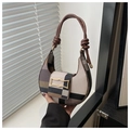 Close-up of contrast patchwork texture and golden hardware on the half-moon bag - Khaki