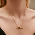 Elegant gold-plated LOVE letter necklace with zircons shown on a female neck - KN0448-Love Letter Rhinestone