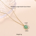 Detailed view of an 18k gold chain necklace with a green oval gemstone pendant - Necklace / Green