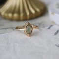 Vintage gold ring with oval light green gemstone and intricate radial carvings - Gold Prehnite Vintage Engraved Ring
