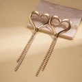 Detailed macro view of 18K gold plated heart earrings with long crystal tassel chains - Silver Needle - Gold - Heart (Tassel)