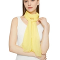 Close-up of lightweight pale yellow chiffon scarf with soft sheen and rolled edges - Goose Yellow