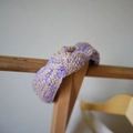 Detail of hand-woven purple and beige raffia headband with a twisted knot design - Purple Series Interwoven Knotted