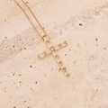 Detailed close-up of 18K gold-plated cross pendant with sparkling zircon on a stone surface - Transparent Zirconia Micro-set Cross (8#)