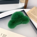 Green fluffy faux rabbit fur hair claw clip in cloud shape on a glass tray - Dark Green