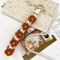 Handmade brown woven daisy flower keychain with wooden bead and gold ring wristlet - Brown + White