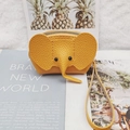 Yellow leather elephant coin purse with litchi texture and wrist strap detail - Earthy Yellow