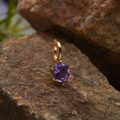 Macro shot of a gold-plated S925 silver pendant featuring a round purple gemstone - Natural Amethyst Round Pendant Gold