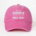 Detail of pink washed cotton baseball cap featuring bold white printed slogan lettering - Rose Red